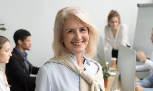 female executive in front of board of directors