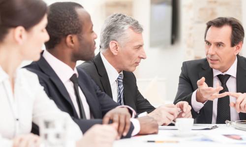 business people meeting and looking serious