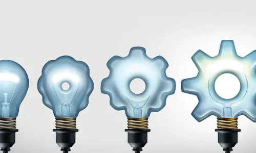 glowing lightbulbs in shape of gears and cogs