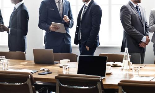 executives having small-group discussions