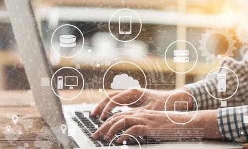 connected icons representing customer information floating above image person typing on a laptop