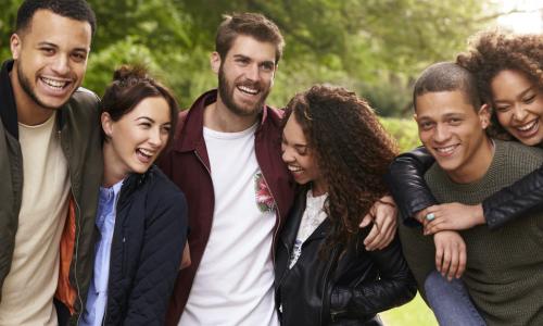 Six young adult friends having fun on a country walk