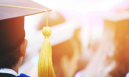 shot of graduation hats during commencement