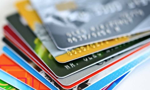 a stack of colorful credit cards
