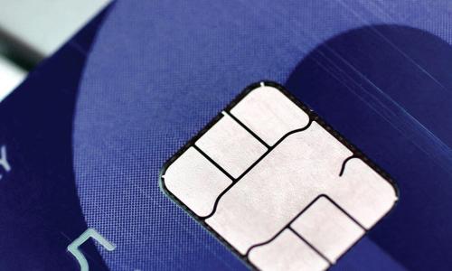 closeup of EMV chip on a blue credit card 