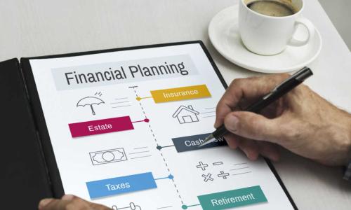 person reviews a financial planning binder