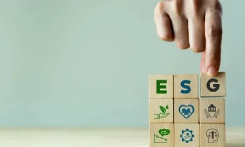 hand with ESG blocks