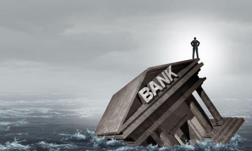 a bank drowns in a choppy sea of water 