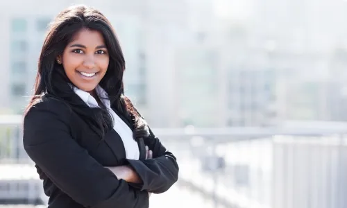 young professional woman smiling confidently at camera