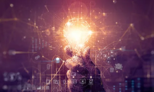 innovation leader holding illuminated lightbulb